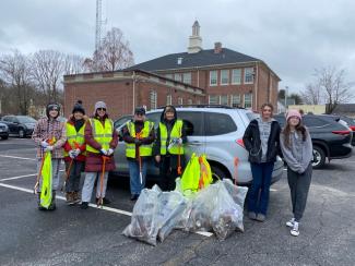 litter collection volunteers posing for a photo